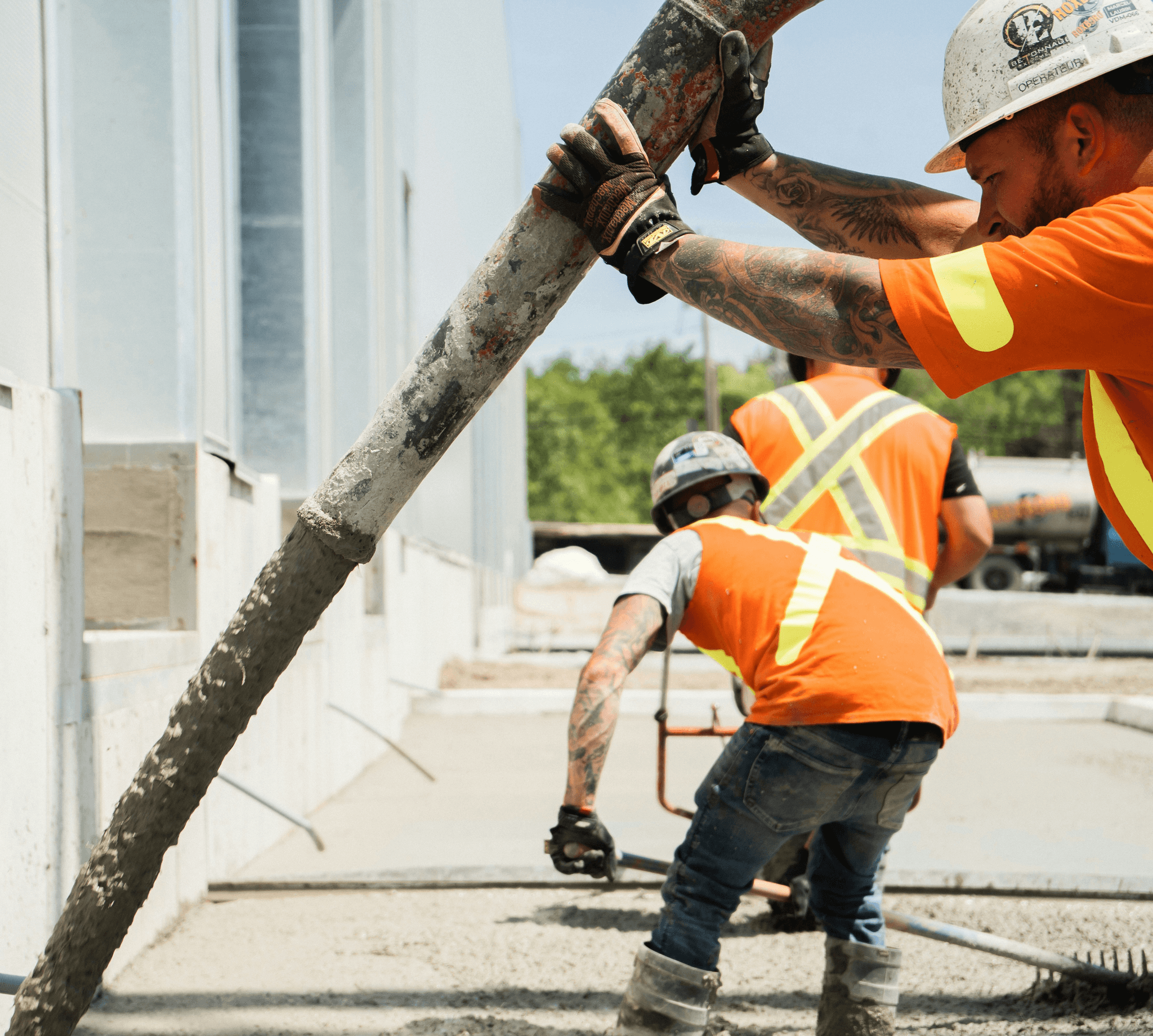 a group of construction workers working on a building